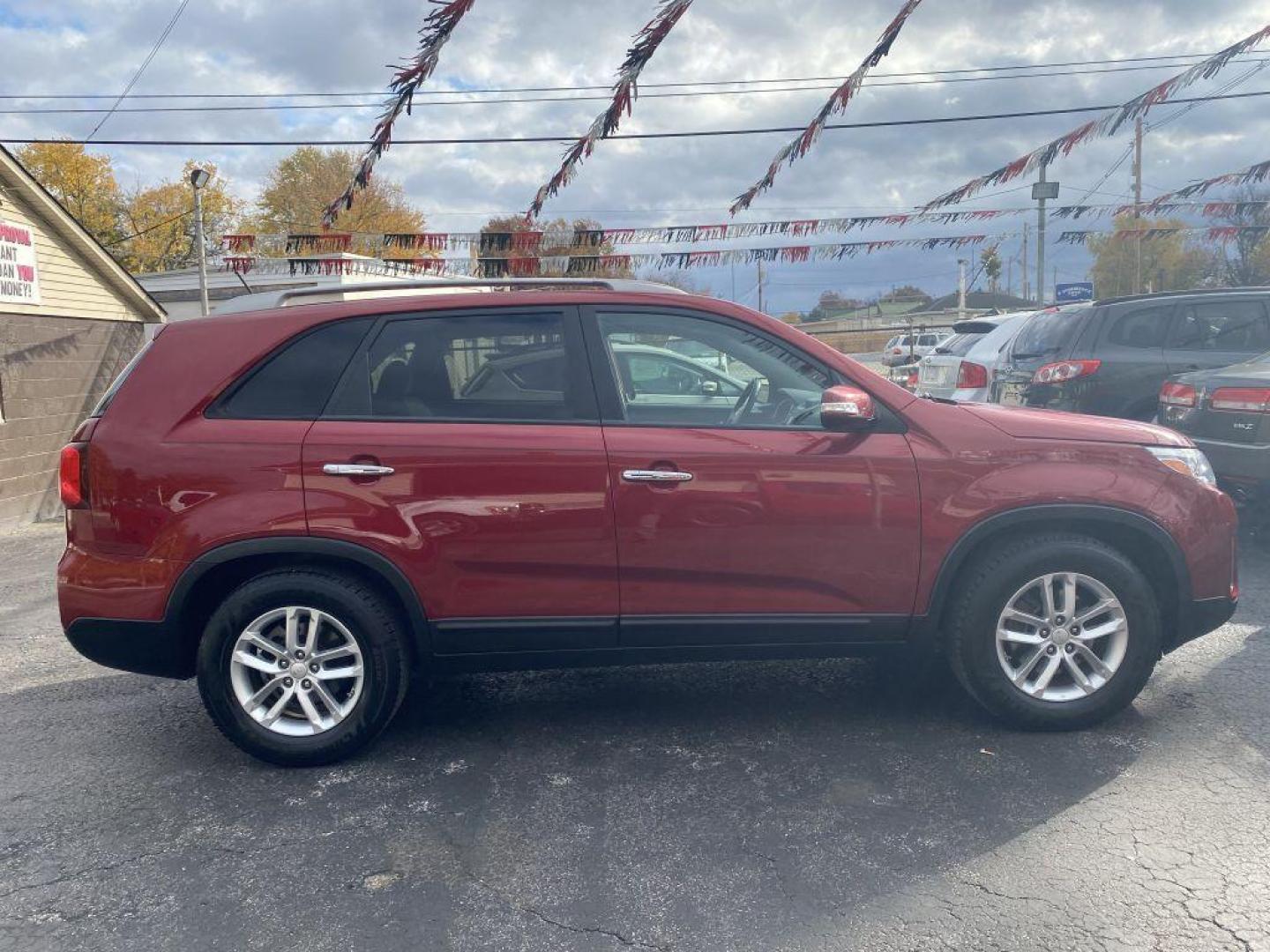 2015 RED KIA SORENTO LX (5XYKT3A61FG) with an 2.4L engine, Automatic transmission, located at 1056 E Riverside Dr, Evansville, IN, 47714, (812) 423-7026, 37.953491, -87.546654 - Photo#0