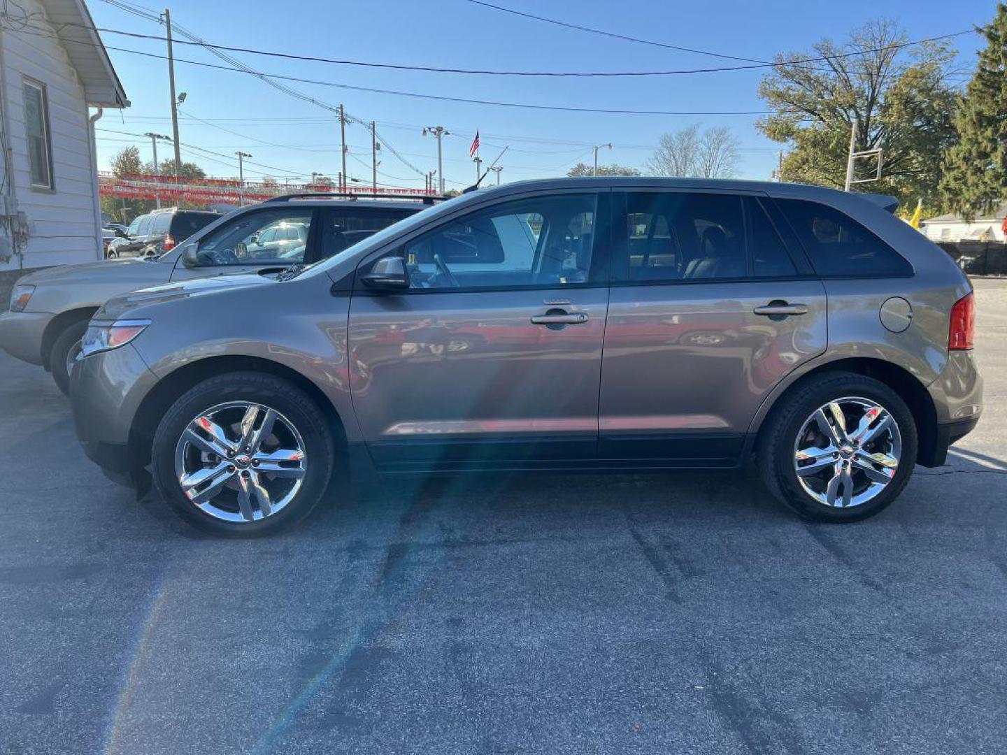 2012 BRONZE FORD EDGE SEL (2FMDK3J90CB) with an 2.0L engine, Automatic transmission, located at 1056 E Riverside Dr, Evansville, IN, 47714, (812) 423-7026, 37.953491, -87.546654 - Photo#0