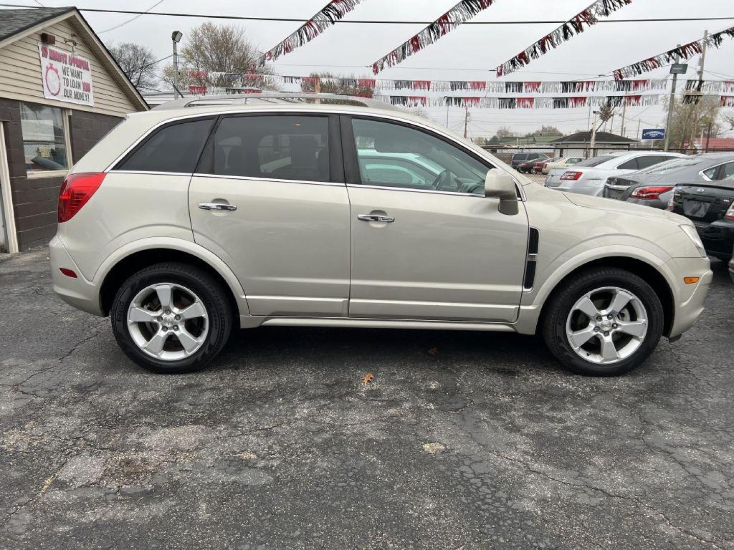 2014 GOLD CHEVROLET CAPTIVA LTZ (3GNAL4EK4ES) with an 2.4L engine, Automatic transmission, located at 1056 E Riverside Dr, Evansville, IN, 47714, (812) 423-7026, 37.953491, -87.546654 - Photo#0