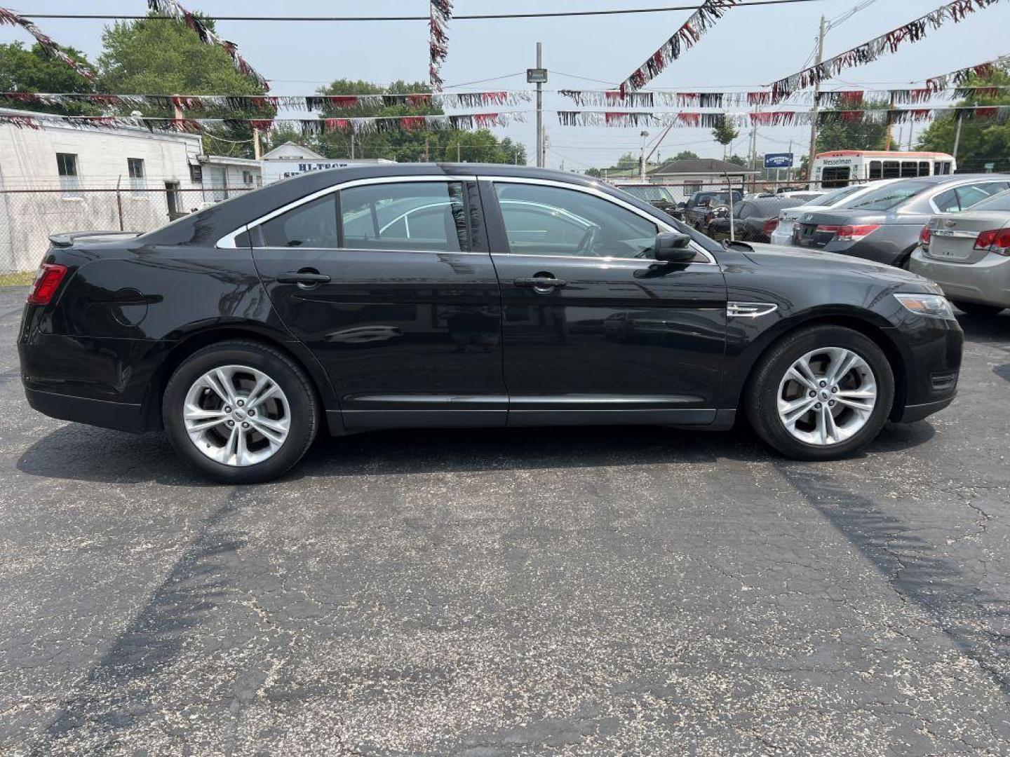 2015 BLACK FORD TAURUS SEL (1FAHP2E86FG) with an 3.5L engine, Automatic transmission, located at 1056 E Riverside Dr, Evansville, IN, 47714, (812) 423-7026, 37.953491, -87.546654 - Photo#0