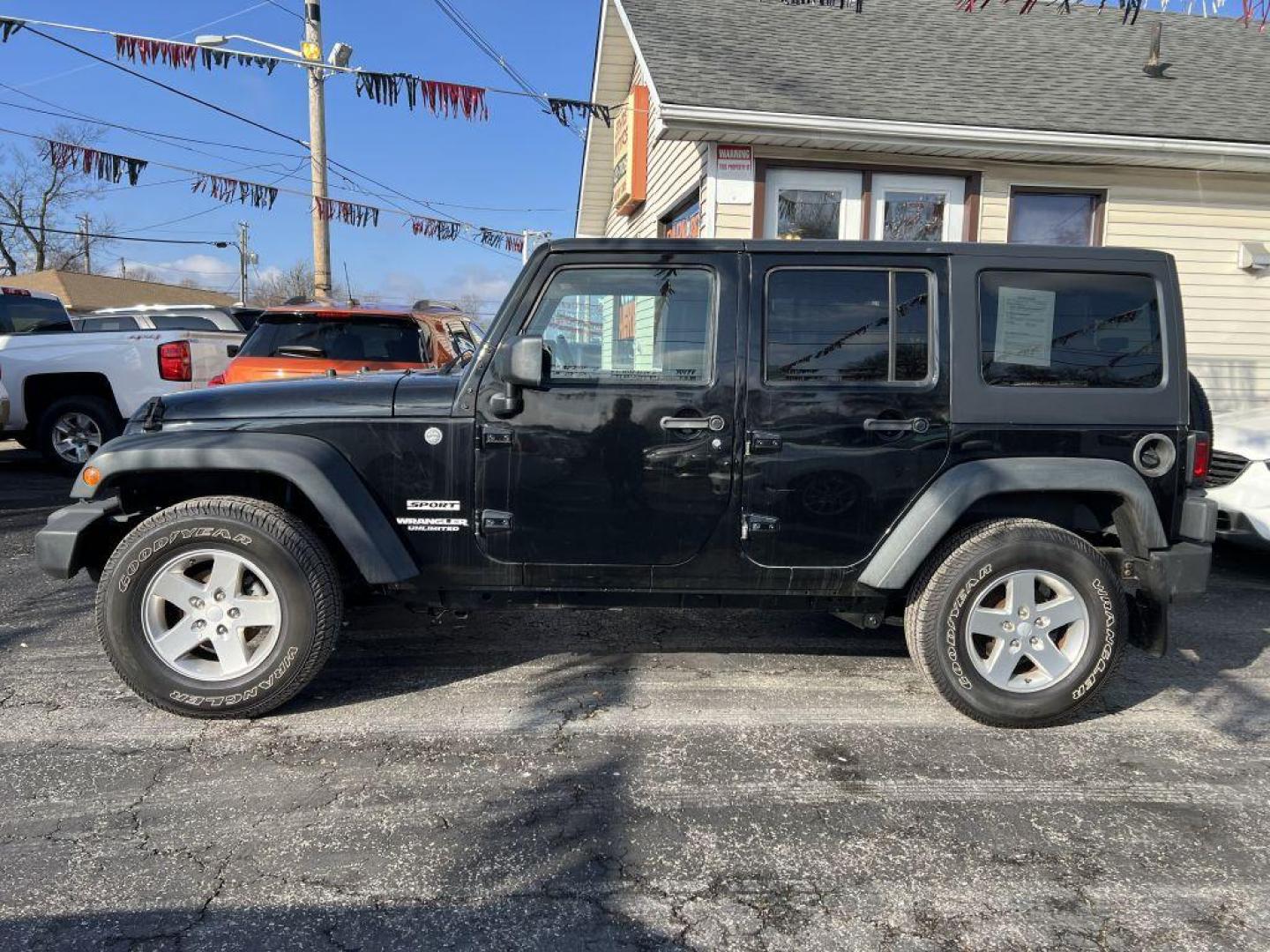 2013 BLACK JEEP WRANGLER UNLIMI SPORT (1C4BJWDG1DL) with an 3.6L engine, Automatic transmission, located at 1056 E Riverside Dr, Evansville, IN, 47714, (812) 423-7026, 37.953491, -87.546654 - Photo#0