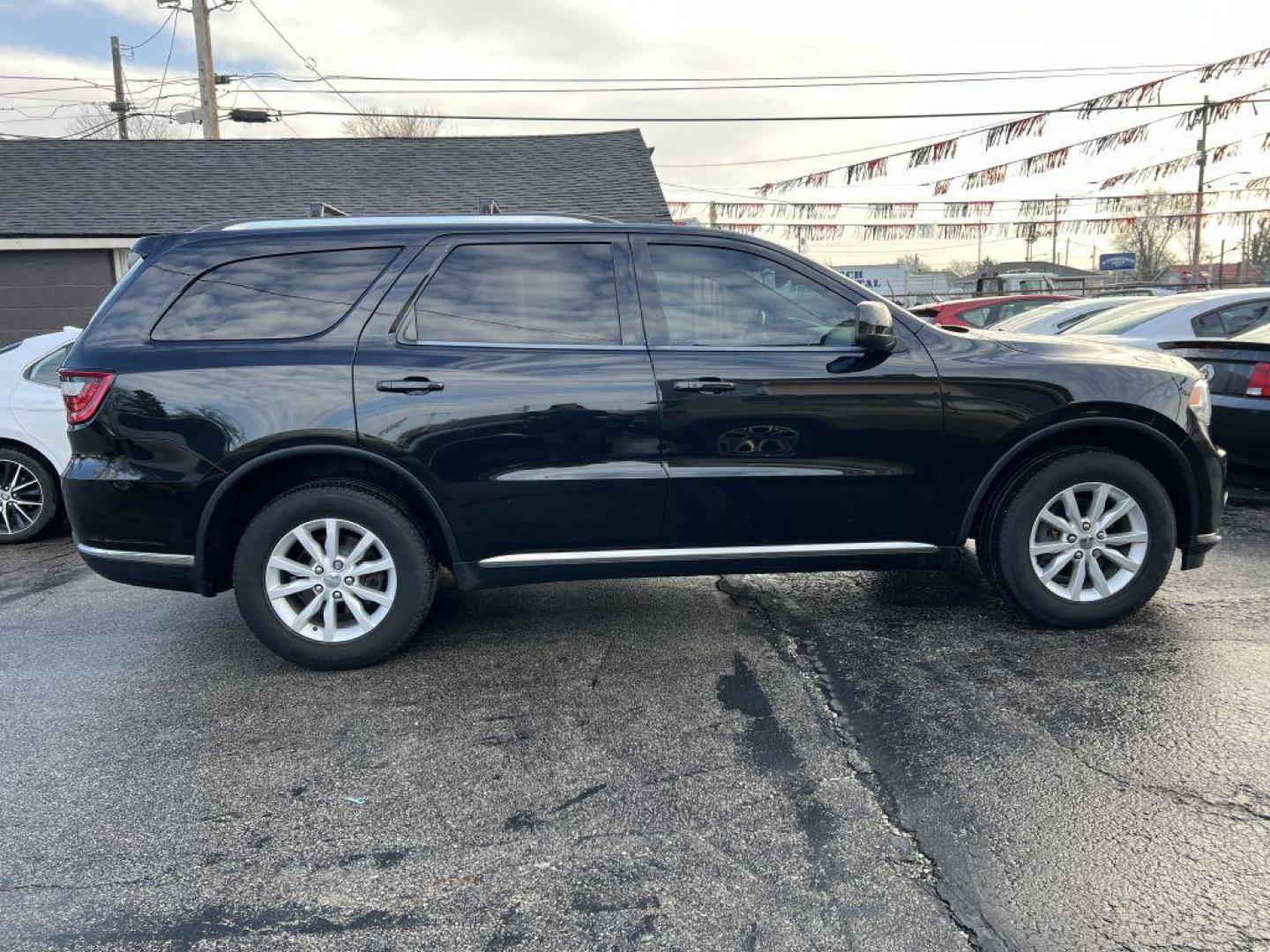 2014 BLACK DODGE DURANGO SXT (1C4RDJAG2EC) with an 3.6L engine, Automatic transmission, located at 1056 E Riverside Dr, Evansville, IN, 47714, (812) 423-7026, 37.953491, -87.546654 - Photo#0