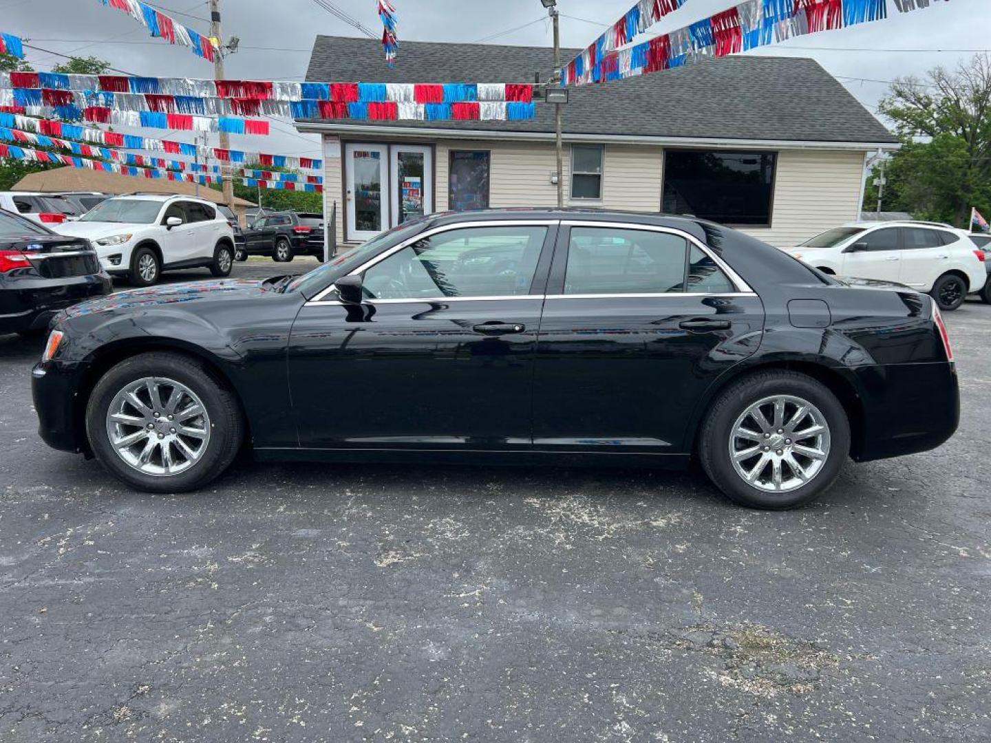 2014 BLACK CHRYSLER 300 (2C3CCAAG3EH) with an 3.6L engine, Automatic transmission, located at 1056 E Riverside Dr, Evansville, IN, 47714, (812) 423-7026, 37.953491, -87.546654 - Photo#0