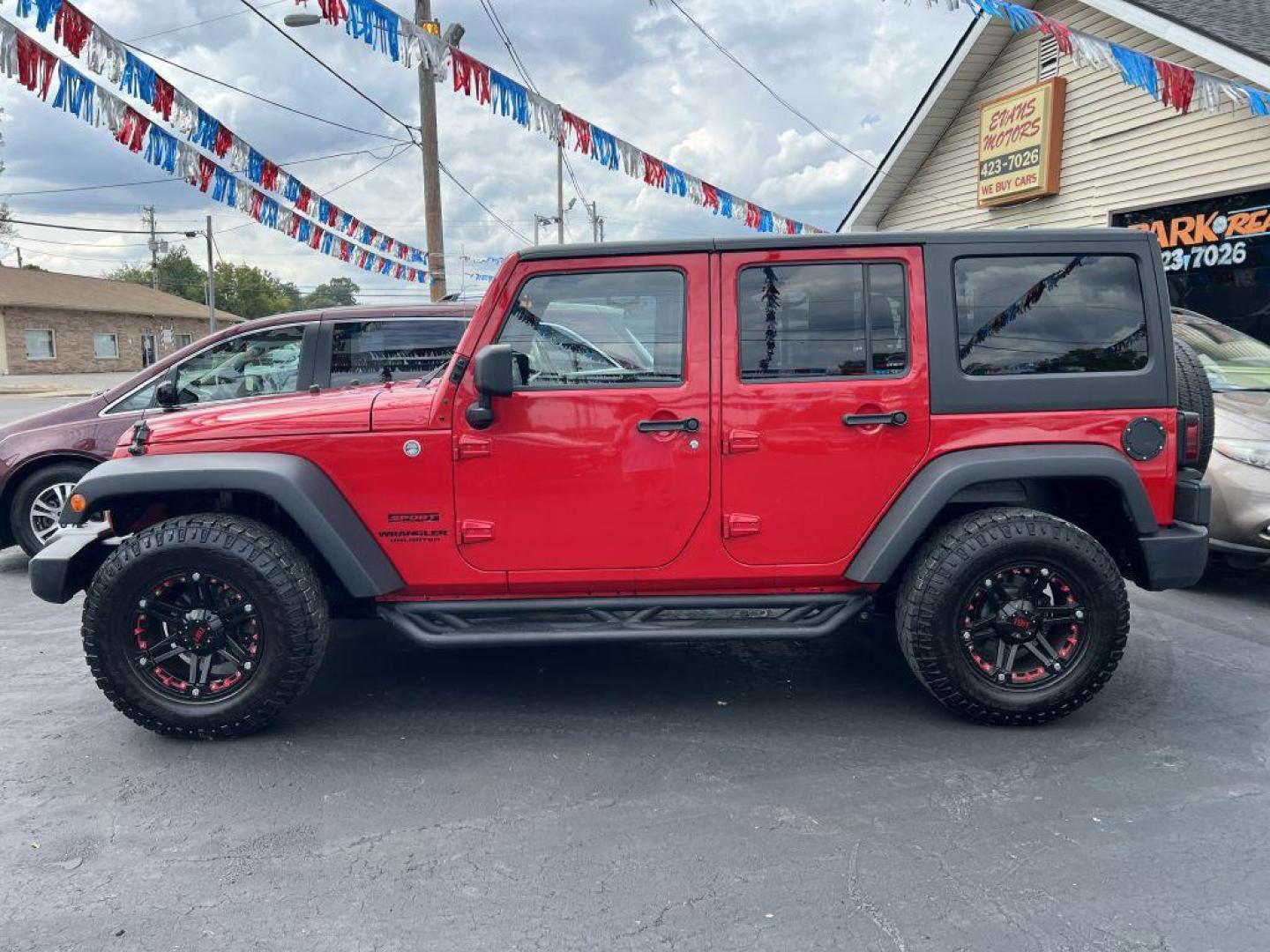 2014 RED JEEP WRANGLER UNLIMI SPORT (1C4BJWDG4EL) with an 3.6L engine, Automatic transmission, located at 1056 E Riverside Dr, Evansville, IN, 47714, (812) 423-7026, 37.953491, -87.546654 - Photo#0