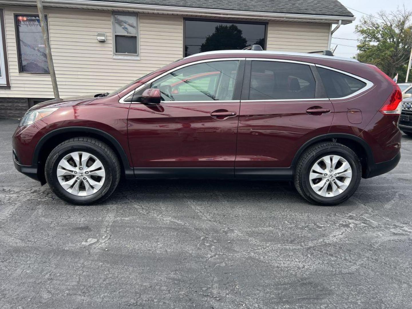 2013 MAROON HONDA CR-V EXL (5J6RM4H79DL) with an 2.4L engine, Automatic transmission, located at 1056 E Riverside Dr, Evansville, IN, 47714, (812) 423-7026, 37.953491, -87.546654 - Photo#0