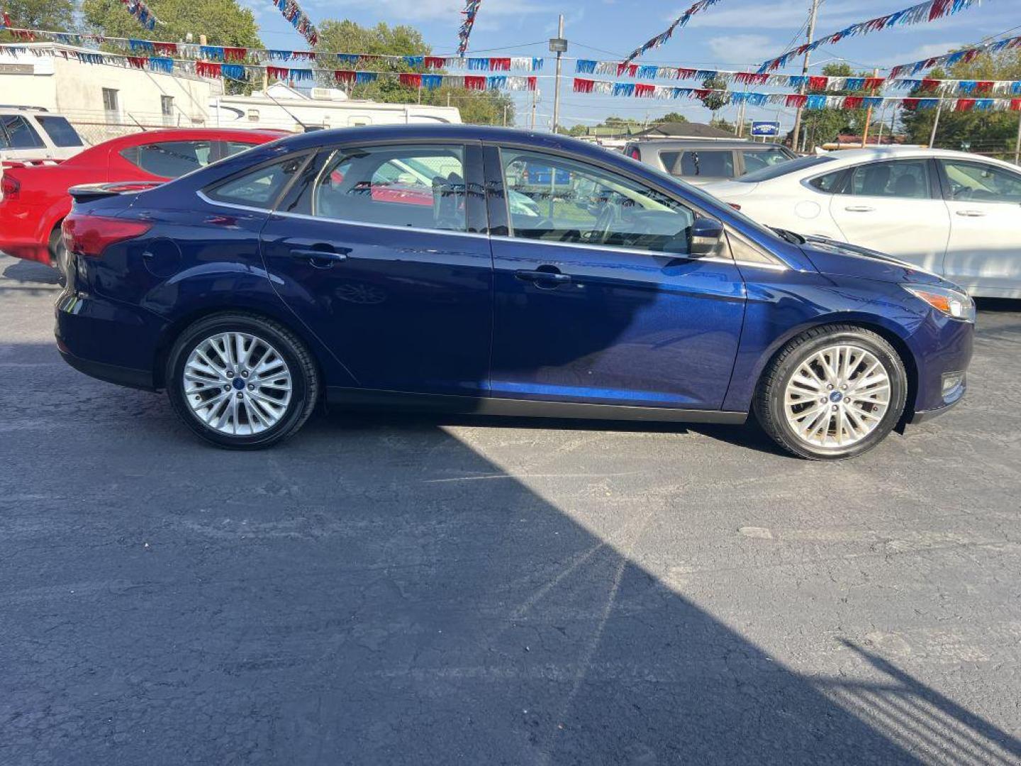 2016 BLUE FORD FOCUS TITANIUM (1FADP3J2XGL) with an 2.0L engine, Automatic transmission, located at 1056 E Riverside Dr, Evansville, IN, 47714, (812) 423-7026, 37.953491, -87.546654 - Photo#0