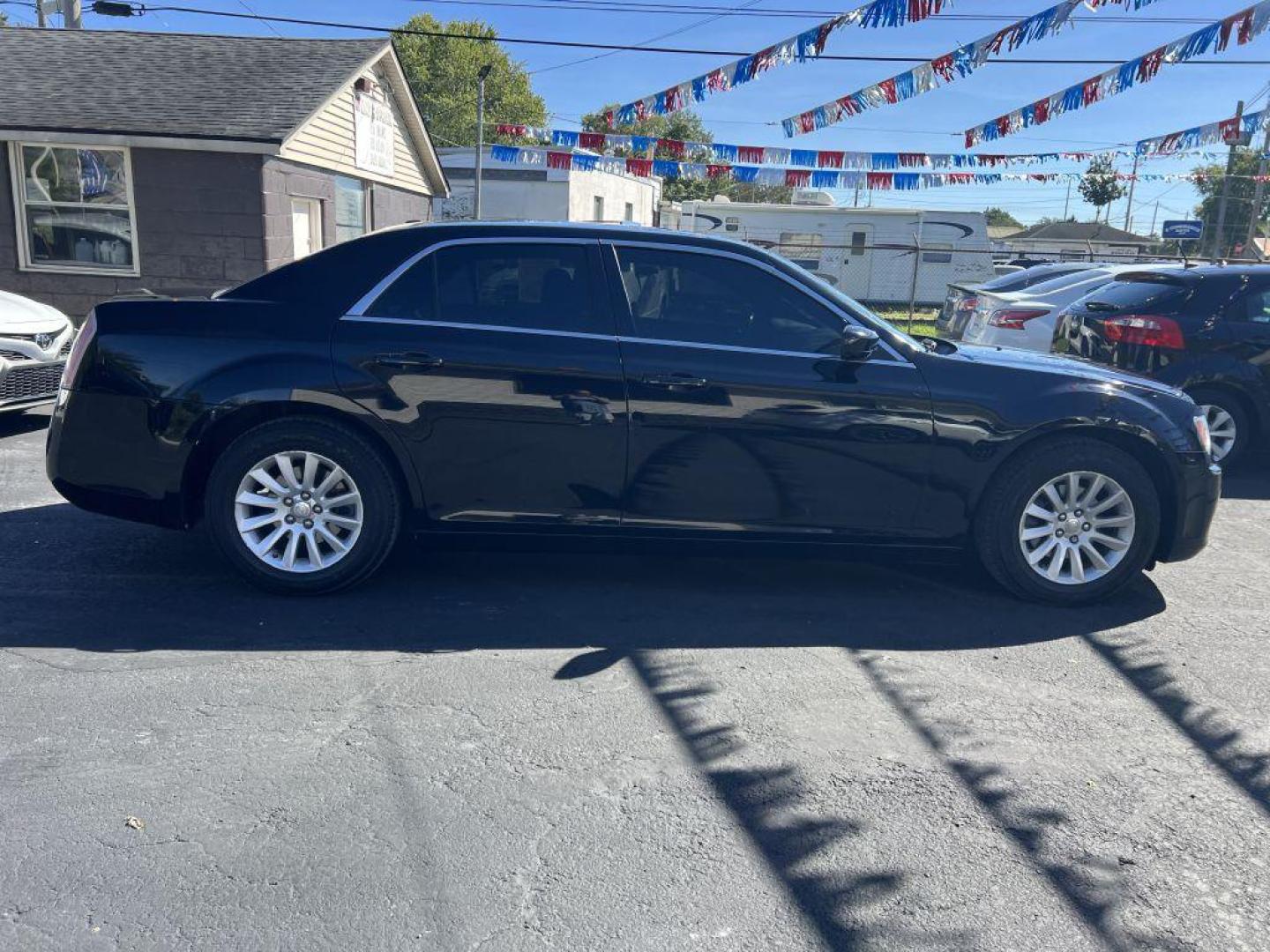 2013 BLACK CHRYSLER 300 4dr (2C3CCAAG9DH) with an 3.6L engine, Automatic transmission, located at 1056 E Riverside Dr, Evansville, IN, 47714, (812) 423-7026, 37.953491, -87.546654 - Photo#0