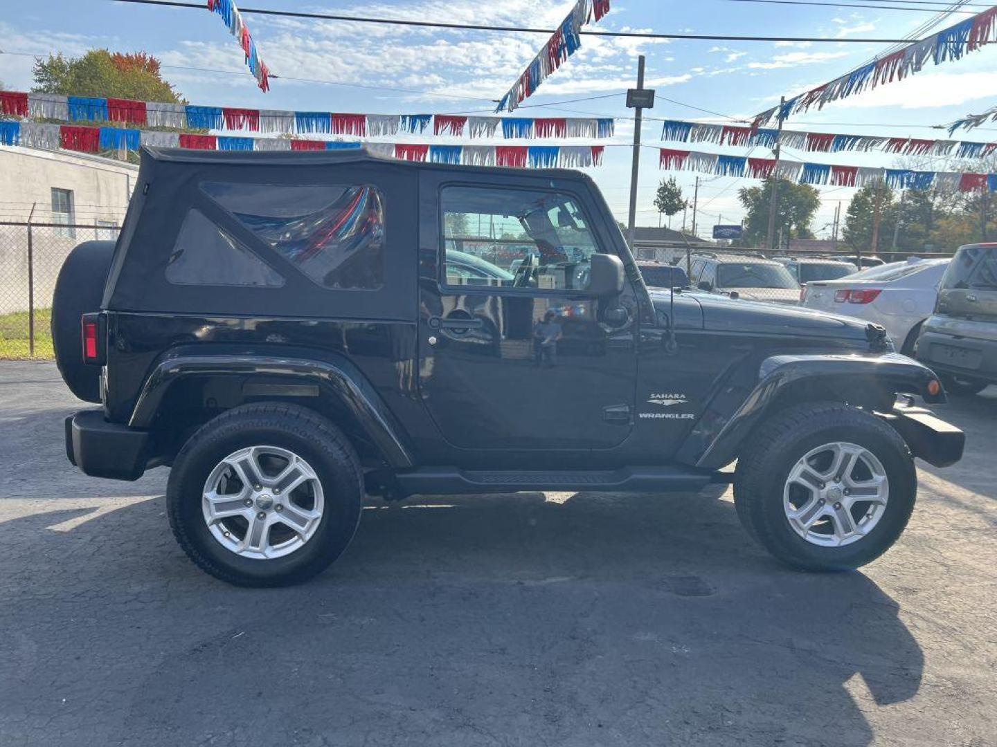 2015 BLACK JEEP WRANGLER SAHARA (1C4AJWBG9FL) with an 3.6L engine, Automatic transmission, located at 1056 E Riverside Dr, Evansville, IN, 47714, (812) 423-7026, 37.953491, -87.546654 - Photo#0