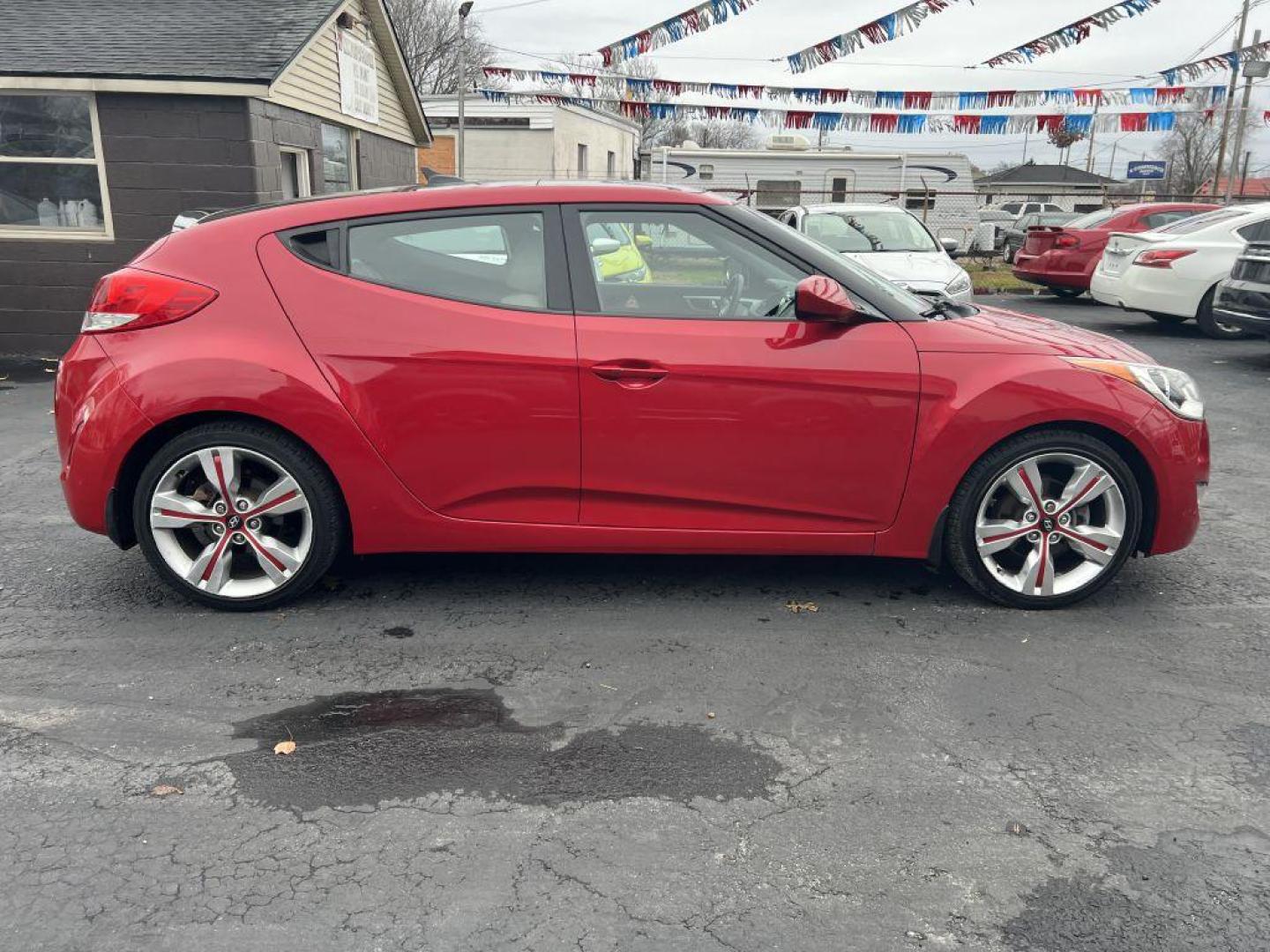 2013 RED HYUNDAI VELOSTER (KMHTC6AD6DU) with an 1.6L engine, Automatic transmission, located at 1056 E Riverside Dr, Evansville, IN, 47714, (812) 423-7026, 37.953491, -87.546654 - Photo#0